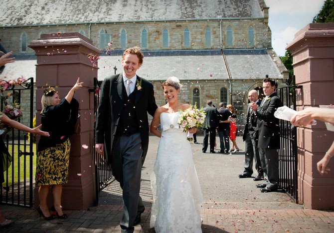 Throwing confetti bride and groom wedding ireland